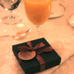 A gift box on a table at the Holiday Donor Breakfast