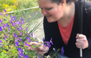 Chelsea smelling the flowers at Ethel L. Dupar's Fragrant Garden