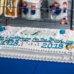 A cake with the Lighthouse logo and the dates 1918-2018
