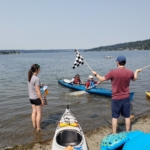 Checkered Flags bringing in Kayak