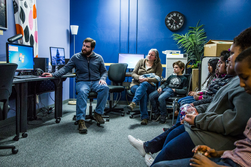 School tour participants learning about assistive technologies at one of the Lighthouse's computer labs