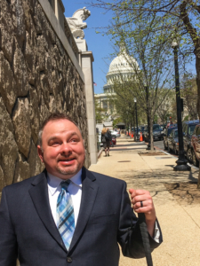 Shawn Dobbs poses for a photo in front of the U.S. Capitol Building in Washington, D.C.