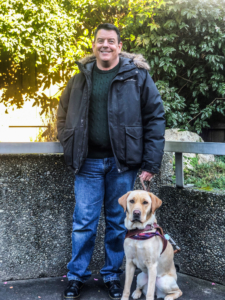 Stephen Hamilton with his guide dog Sumiko.