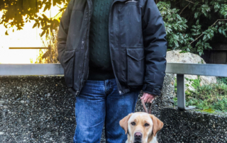 Stephen Hamilton with his guide dog Sumiko.