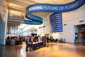 View of event with peole mingling at tables