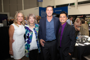 four people posing for photo