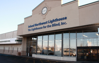 Image of the outside of the building with "Inland Northwest Lighthouse" in large letters above the doors.