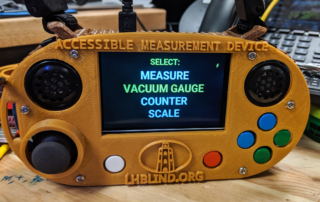 An accessible measuring device, a yellow handheld device with a large print screen