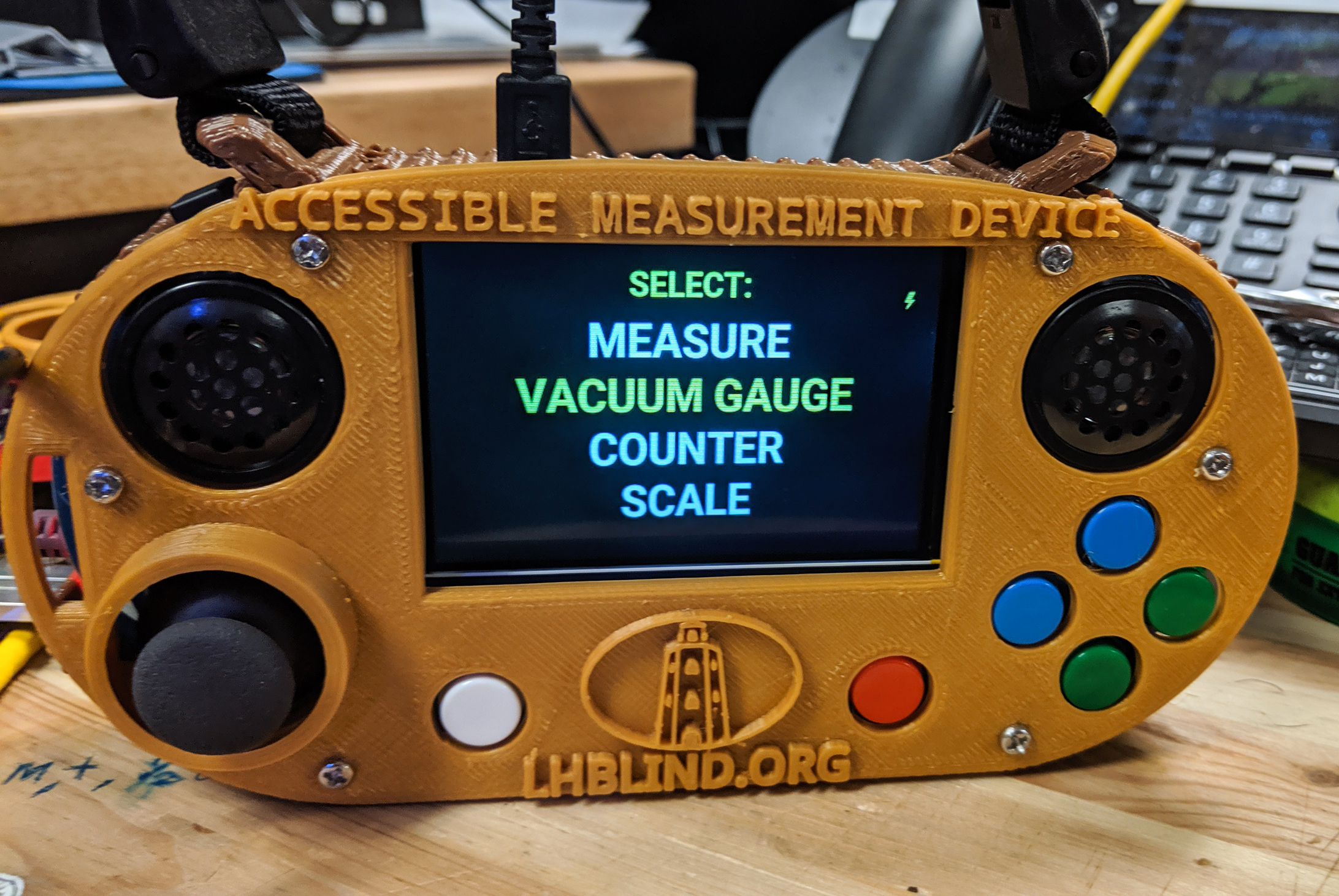 An accessible measuring device, a yellow handheld device with a large print screen