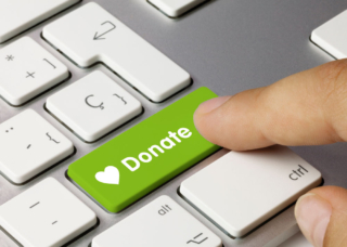 A button on a keyboard labeled "Donate"
