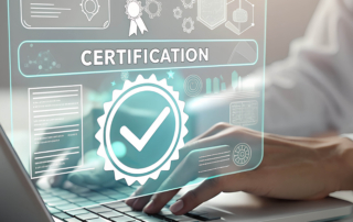 Hands on a laptop keyboard with graphics floating above the hand showing the word "Certification"