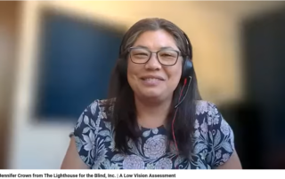 Dr. Jennifer Crown Smiling at the camera with a headset on, and a floral shirt.